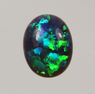 Lab Created Opal:  Oval Cabochon D. Turquoise (k-13) Lab Created Opal