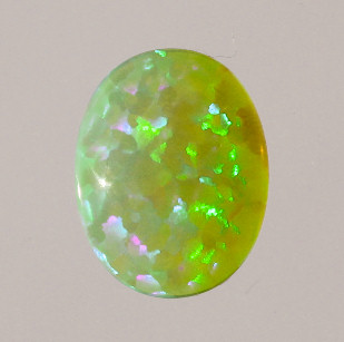 Lab Created Opal:  Oval Cabochon Light Green (k-51) Lab Created Opal